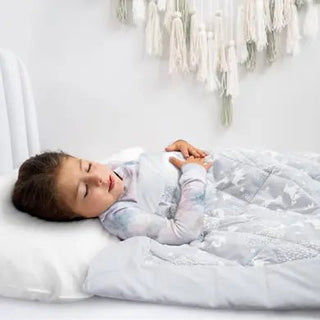 toddler girl sleeping with toddler-bed weighted blanket