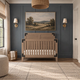 A rustic Child Craft Lucas 4-in-1 Convertible Crib in Dusty Heather with dark corner accents centered in a nursery against a dark blue paneled wall.