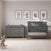 Child Craft Denman 4-in-1 Convertible Crib in Midnight Gray and matching six-drawer dresser with a changing top, positioned against a shiplap wall with four framed botanical prints.