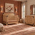 A Child Craft Lucas 4-in-1 Convertible Crib in Nutmeg and a matching three-drawer dresser, both featuring black corner hardware, in a modern farmhouse nursery with terracotta-colored walls.