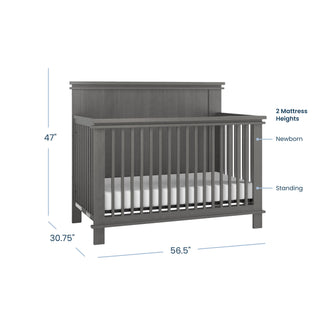 Midnight Gray Child Craft Denman 4-in-1 Convertible Crib with height, width, and depth labels, showing two mattress positions for newborn and toddler stages of the design.