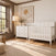 Child Craft Atwood 2-Piece Nursery Set With Crib and Dresser in white wood, shown in a bedroom with a patterned rug and framed wall art.