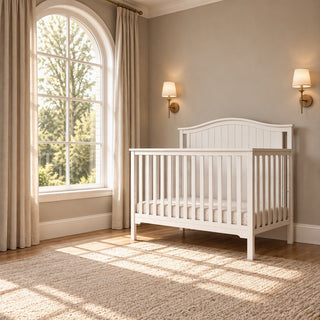 Hampton Arch Top 4-in-1 Convertible Crib in matte white with an arched headboard.