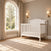 Hampton Arch Top 4-in-1 Convertible Crib in matte white with an arched headboard.