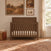 Child Craft Kieran 4-in-1 Convertible Crib in toasted chestnut, featuring vertical slats and a herringbone pattern on the headboard.