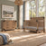 A Child Craft Lucas 4-in-1 Convertible Crib in Dusty Heather and a matching three-drawer dresser with black corner accents in a sunlit modern farmhouse nursery.