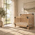 Child Craft Lucas 4-in-1 Convertible Crib in Nutmeg, a 4-in-1 convertible wooden crib featuring modern farmhouse styling with black corner accents.