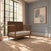 Child Craft Surrey Hill 4-in-1 Convertible Crib in toasted chestnut with a paneled headboard, set on a textured rug in a nursery with a large window and gray walls.