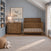 A Child Craft Atwood 3-Drawer Dresser in Cocoa Bean and a crib with a matching wood chevron pattern, displayed in a nursery setting with a rug and wall decor.