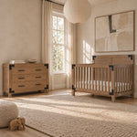 Child Craft Lucas 2-Piece Nursery Set with Crib and Dresser featuring a shiplap headboard and a three-drawer dresser, both with dark metal corner accents, in a modern farmhouse nursery.
