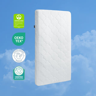 The HALO DreamWeave™ Breathable Crib Mattress floats against a blue, clouded sky, highlighted by four badges: GREENGUARD Gold, OEKO-TEX, hypoallergenic product, and Allergy Standards Limited verified.