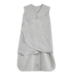 The HALO Swaddle 100% Cotton TOG 1.5 in gray has a double front zipper and adjustable Velcro wings for customizable swaddling, promoting healthy hip development. Its soft fabric keeps infants cozy.