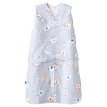 The HALO Swaddle 100% Cotton TOG 1.5 in light blue features a zipper, adjustable wings for healthy hip development, and an overlapping swaddle printed with cute orange, blue, and white lion and bear faces.