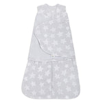 The HALO Swaddle Micro-Fleece TOG 3.0, a gray wearable baby blanket with white stars, features adjustable wings and a front zipper. Its sleeveless design ensures healthy hip development while providing a soft, snug fit to keep your baby warm and secure.