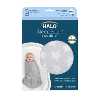 The HALO Swaddle Micro-Fleece TOG 3.0 packaging features a newborn in a gray swaddle with white stars, highlighting the micro-fleece material, TOG 3.0 rating, adjustable wings, and support for healthy hip development for babies from birth to 3 months.