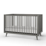 The Child Craft Cranbrook 4-in-1 Convertible Crib in Lunar Gray features modern vertical slats on all sides and a white mattress, shown against a plain white background—perfect nursery furniture.