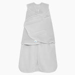 The HALO Swaddle Micro-Fleece TOG 3.0 in light gray, featuring adjustable swaddle wings, a bottom zipper, and soft fleece texture, is shown against a white background.