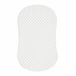 The HALO BassiNest® Fitted Sheet 100% Cotton features a white, contoured envelope design with a subtle geometric pattern. Set against a plain background, it is gentle on delicate skin and tapers slightly at the center for a secure fit.