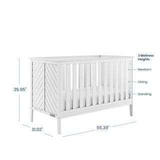 The Child Craft Atwood 3-in-1 Euro Convertible Crib in Matte White features slatted sides, chevron diagonal panels, and three mattress heights (Newborn, Sitting, Standing). Dimensions: 35.95"H x 31.02"D x 55.39"W.