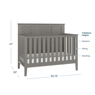 The Child Craft Atwood 4-in-1 Convertible Crib in Lunar Gray features slatted sides, a decorative back panel, baby-safe finishes, three mattress heights (newborn to standing), and converts easily to a toddler bed. Dimensions: 47"H x 55.75"W x 30"D.