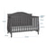 The Child Craft Camden 4-in-1 Convertible Crib in Cool Grey features slatted sides, an arched back panel, and a mattress that adjusts to three heights. Dimensions: 44.25
