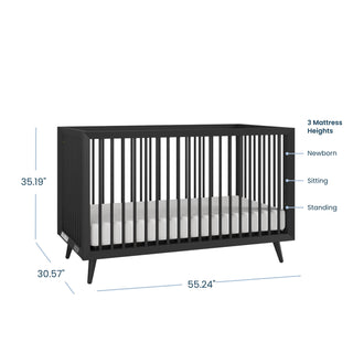 The Child Craft Cranbrook 4-in-1 Convertible Crib in Ebony features vertical slats and measures 35.19" H x 30.57" D x 55.24" W, with three mattress heights for newborn, sitting, and standing stages—perfect for a versatile nursery.
