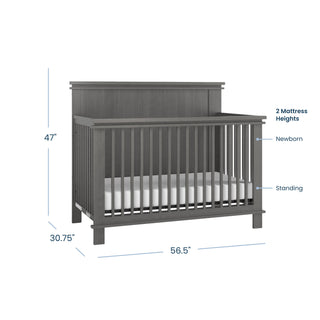 The Child Craft Denman 4-in-1 Convertible Crib in Midnight Gray features slatted sides, a solid headboard, two mattress heights, and a craftsman design. Dimensions: 47" tall, 30.75" deep, and 56.5" wide—ideal nursery furniture.