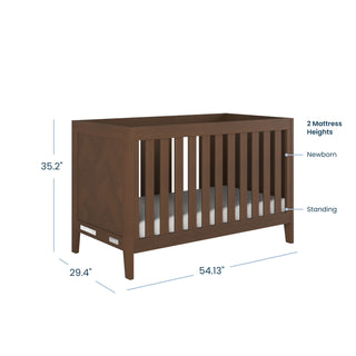 The Child Craft Kieran 3 Piece Nursery Set with Crib, Dresser, and Chest includes a modern convertible crib featuring vertical wooden slats and measuring 35.2" tall, 29.4" deep, and 54.13" wide. The crib offers two adjustable mattress heights—Newborn (higher) and Standing (lower)—allowing it to grow with your child and easily coordinate with any nursery furniture set.