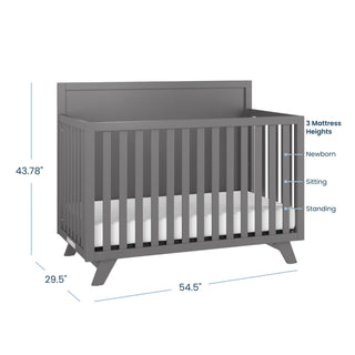 The Child Craft Soho 4-in-1 Flat Top Convertible Crib in Cool Gray features a high back panel, slatted sides, and measures 43.78"H x 29.5"D x 54.5"W. Mattress adjusts to three heights—ideal nursery furniture for growing babies.