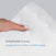 A close-up shows a hand holding the HALO Essential Breathable Crib Mattress with a white, textured, wavy pattern. Text reads: Breathable Cover - Designed for cooler, more comfortable sleep, against a soft gray background promising restful nights and breathable comfort.