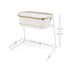 The HALO BassiNest® Lite Portable Bassinet is a white and beige baby bassinet with breathable mesh walls on a sleek white frame. It has adjustable heights from 35.5 to 39.75, measures 28 wide by 39 long, and the base extends 2 on each side.