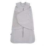 A light gray HALO SuperSoft Bamboo Swaddle TOG 2.0, featuring a zippered front and adjustable Velcro wings, made from soft bamboo fabric, is shown laid flat on a white background.