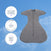The HALO SwaddleStretch™ Newborn Swaddle TOG 0.5 in gray is displayed against a blue sky with clouds, with three circles highlighting its key features: extensive research and testing, trusted use in hospitals, and a patented sleeve design—making this hip-healthy sleep sack the ideal option for ultimate comfort and support.