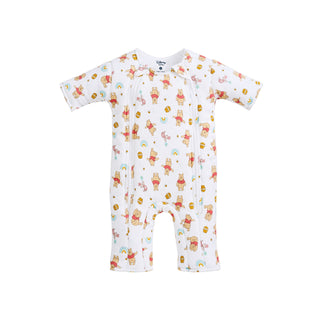 The HALO Disney® Winnie the Pooh Baby Merlin’s Magic Sleepsuit® 100% Cotton features a white, long-sleeved design adorned with an adorable Winnie the Pooh, honey pot, and rainbow print. Perfect for swaddle transition, this cozy baby sleep suit is displayed on a plain white background.