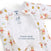 Close-up of the Disney® Winnie the Pooh Baby Merlin’s Magic Sleepsuit® 100% Cotton by HALO, featuring adorable prints of Winnie the Pooh and friends with rainbows and honey pots. This sleepsuit is perfect for transitioning from swaddling, providing comfort as your baby adjusts. The suit includes a convenient double zipper for easy opening, as highlighted by the open flap labeled “Double zipper for easy opening.”.