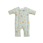 Light green Disney® Lion King Baby Merlin’s Magic Sleepsuit® by HALO, made from 100% cotton, showcasing beloved Lion King characters with dual front zippers and short sleeves—perfect for smooth swaddle transition to promote healthier sleep routines. Presented flat against a white background.