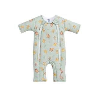 Light green Disney® Lion King Baby Merlin’s Magic Sleepsuit® by HALO, made from 100% cotton, showcasing beloved Lion King characters with dual front zippers and short sleeves—perfect for smooth swaddle transition to promote healthier sleep routines. Presented flat against a white background.