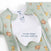 A mint green Disney® Lion King Baby Merlin’s Magic Sleepsuit® by HALO, made from 100% cotton, features Lion King characters and a convenient double zipper for easy opening—perfect for a smooth swaddle transition during your baby’s sleep transition. The sleepsuit is shown partly unzipped to reveal the label and inner flap that reads “Double zipper for easy opening.”.