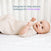 A baby lies on their back in a HALO Easy Transition SleepSack TOG 1.5 in a crib, with text above reading Designed to help reduce wakeups for extra sleep.