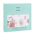 A teal box contains an aden + anais boutique cotton muslin dream blanket, made for breathability from 100% cotton. A window displays its floral and bird motif in pink and white. Text on the packaging appears in English and French.