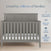The Child Craft Atwood 4-in-1 Convertible Crib in Lunar Gray sits before a pale wall reading 
