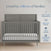 A Surrey Hill 4-in-1 Convertible Crib by Child Craft in Lunar Gray with a white mattress stands against a pale wall. Above, text reads Loved by millions of families, with icons for 70+ years' experience and trusted certification.