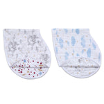 The aden + anais boutique 100% cotton muslin burpy bibs 2 pack features two cloths with whimsical patterns: one with gray elephants and gold stars, the other with blue clouds and rainbows. They are neatly folded, ready for magical messes.