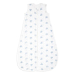 The aden + anais organic cotton light sleep sack TOG 1.0 is a sleeveless, white baby sleeping bag crafted from 100% organic cotton muslin with a front zipper. Featuring light blue elephants, it offers a cozy and breathable design for infants and is GOTS certified for safe and comfortable sleep.