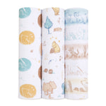 Three vertically displayed rolled-up baby swaddles from the aden + anais Disney™ boutique 100% cotton muslin collection showcase different patterns: teal and orange bears and suns, bears with honey pots and trees, and Disney-inspired aquamarine woodland creatures.