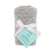 The snuggle knit™ swaddle blanket by aden + anais is a cozy, gray knit baby product. It comes rolled with a white ribbon and blue tag, offering warmth and versatility thats perfect for any nursery.