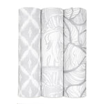 The boutique silky soft swaddle blanket 3 pack by aden + anais includes three bamboo-viscose blankets: one with a gray and white diamond design, another featuring elephants, and a third with a leaf pattern, all delivering ultimate comfort.