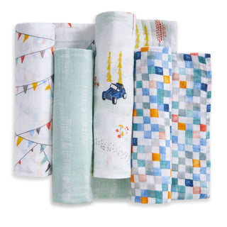 Four aden + anais essentials cotton muslin swaddle blankets in assorted pastel prints are displayed in a row on a white background, showcasing this breathable baby blanket 4-pack set.