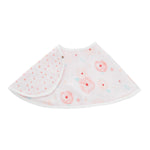 The aden + anais essentials cotton muslin burpy bib is semi-circular and absorbent, featuring a floral design with pink flowers on one side and a polka dot pattern on the other. It includes a white trim and snap button closure for convenience.