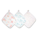 The aden + anais essential cotton muslin washcloths 3 pack showcases three designs: pink floral, blue leafy, and pink polka dots. Each washcloth features absorbent layers for delicate skin and includes a small hanging loop.